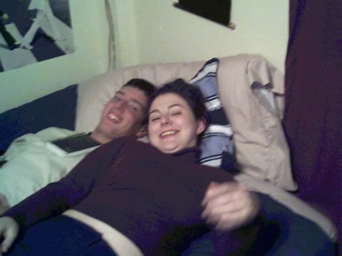 chris and jenn on the bed